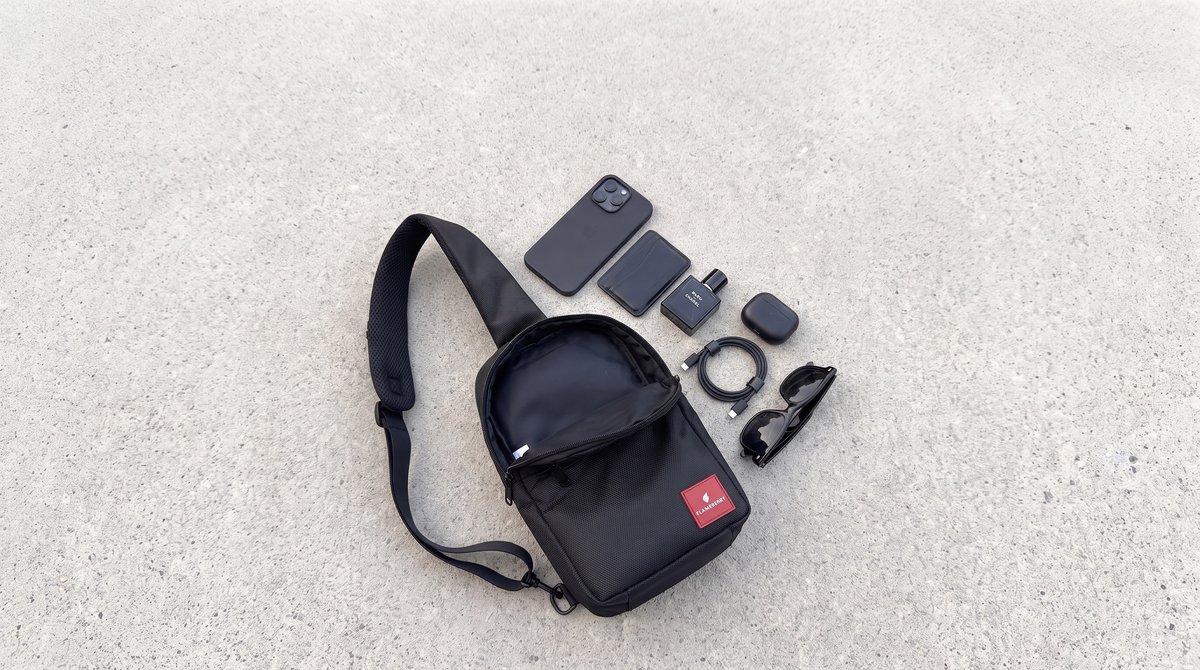 Flameberry sling bag flat lay with travel essentials